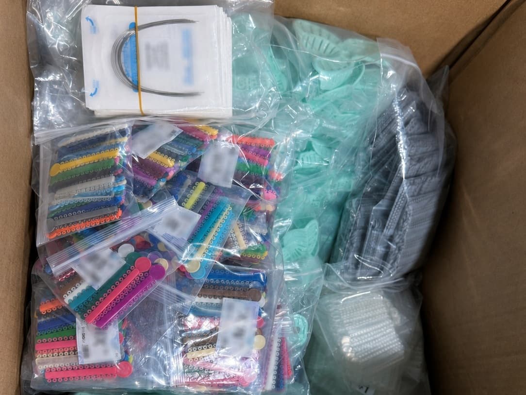 Multiple orthodontic product categories organized in a carton for order preparation